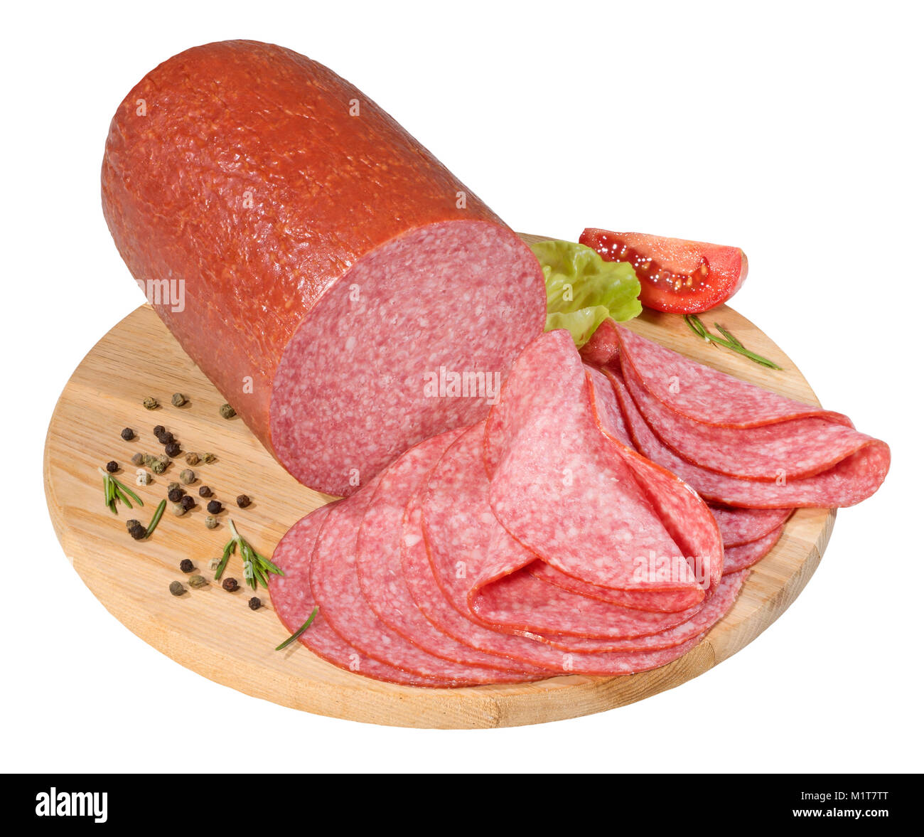 Fette di salame su un tagliere Foto Stock