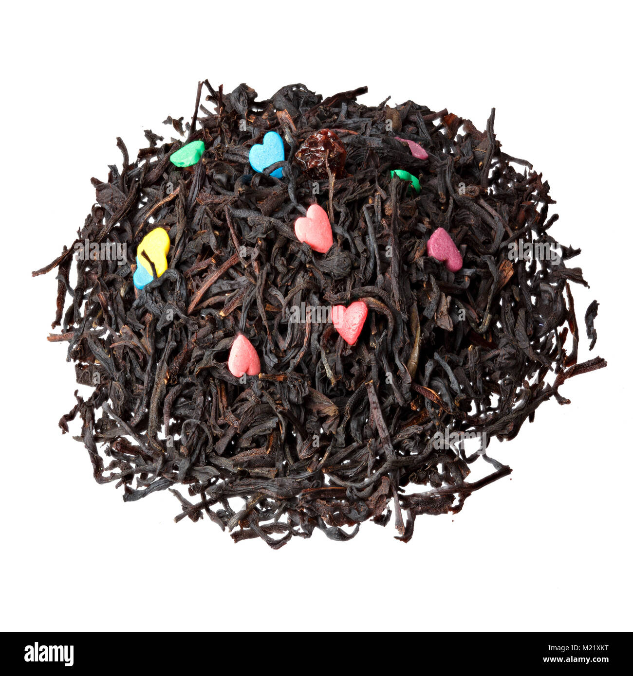 Bollitore per tè e romanticismo. Tè nero con dolci a forma di cuore. Foto Stock