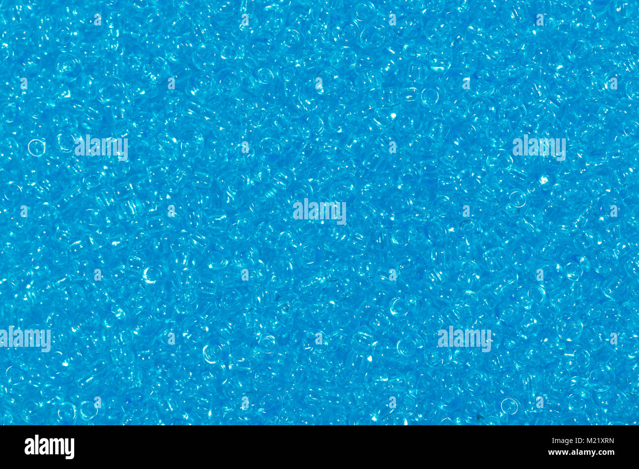 Fotografia multicolore di vetro blu perline di sementi di sfondo. Foto Stock