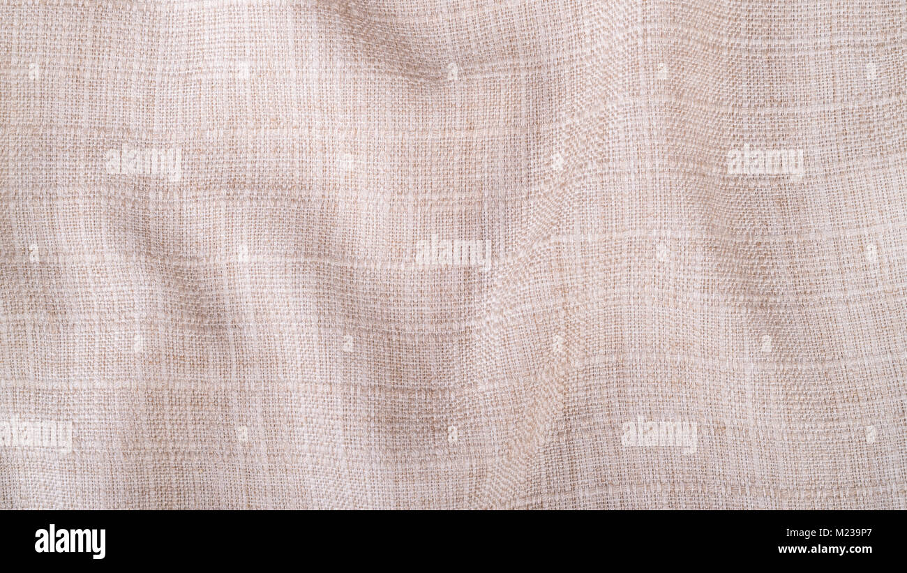 Trama decorative dal tessuto ondulato. Elegante sfondo beige dal tessile increspata con copia spazio. Foto Stock