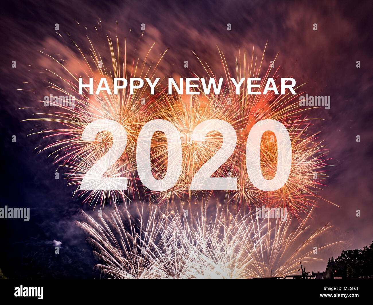 Felice anno nuovo 2020 con sfondo di fuochi d'artificio. Celebrazione Nuovo Anno 2020 Foto Stock