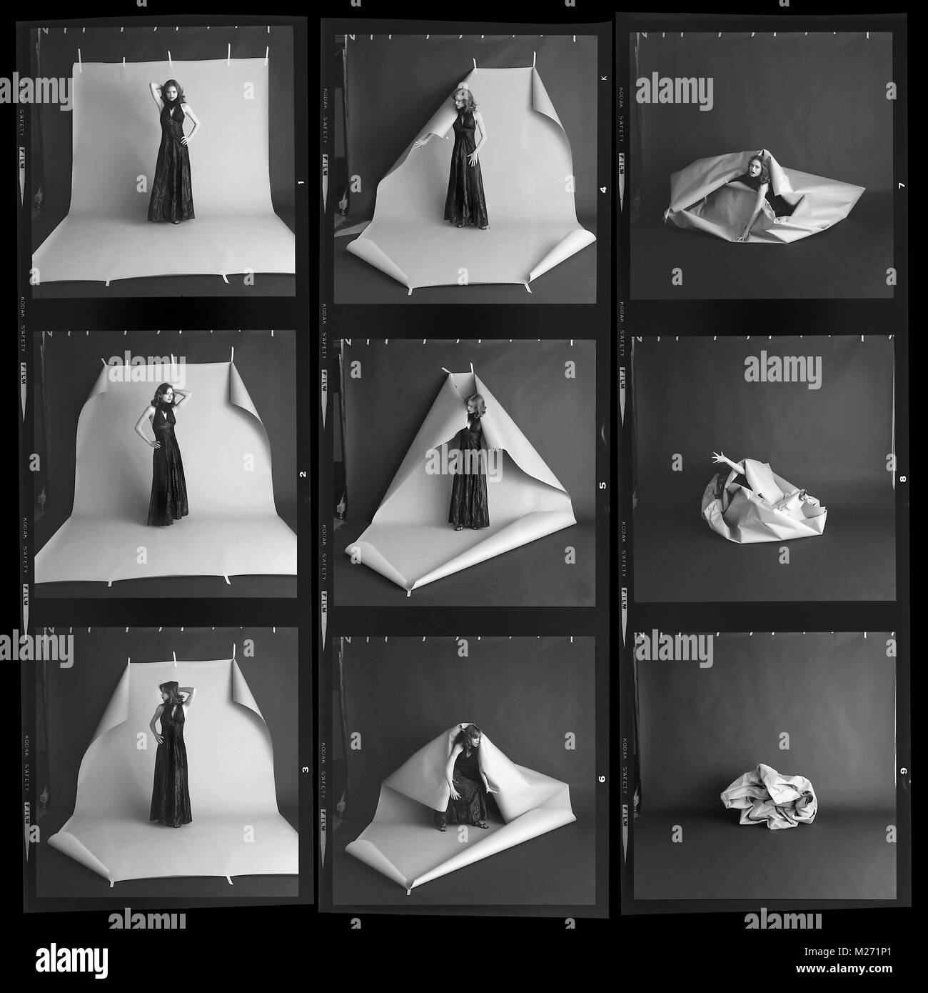 Modello di moda Bridgett è spazzata via in un fotografico sullo sfondo di scansione. Medio formato foglio di prova con 6x6 cm film. Foto Stock