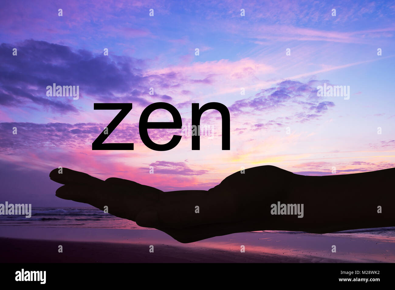 Offerta di mano la parola zen, sfondo al tramonto Foto Stock