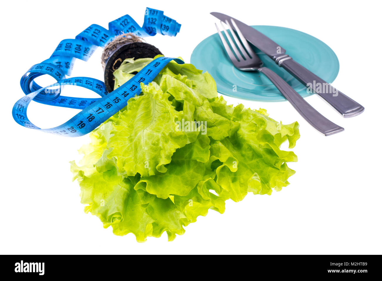 Il concetto di perdita di peso. Alimenti dietetici, insalata verde Foto Stock