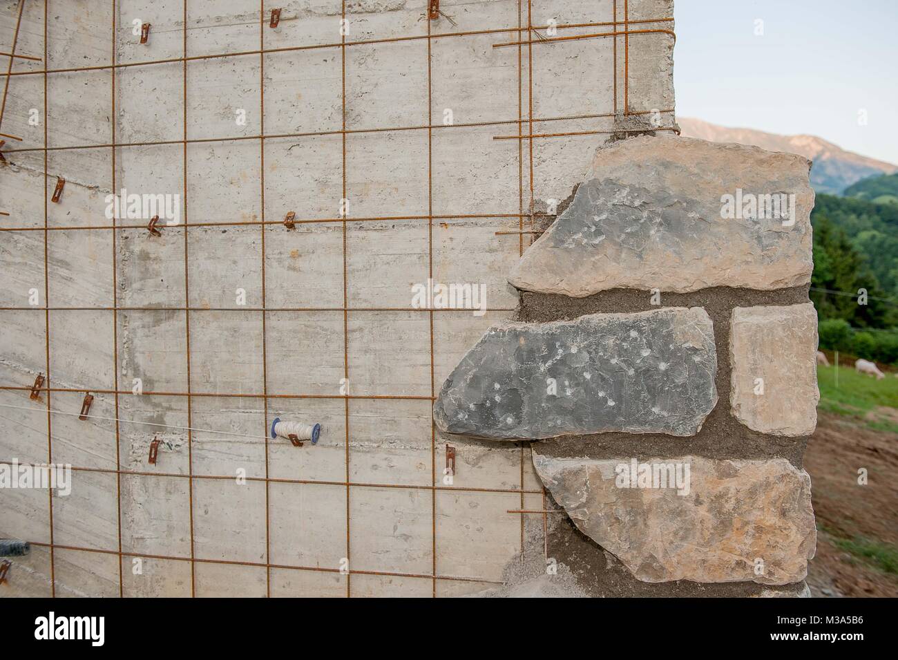 Il rivestimento con pietre a rendere la parete estetico Foto Stock