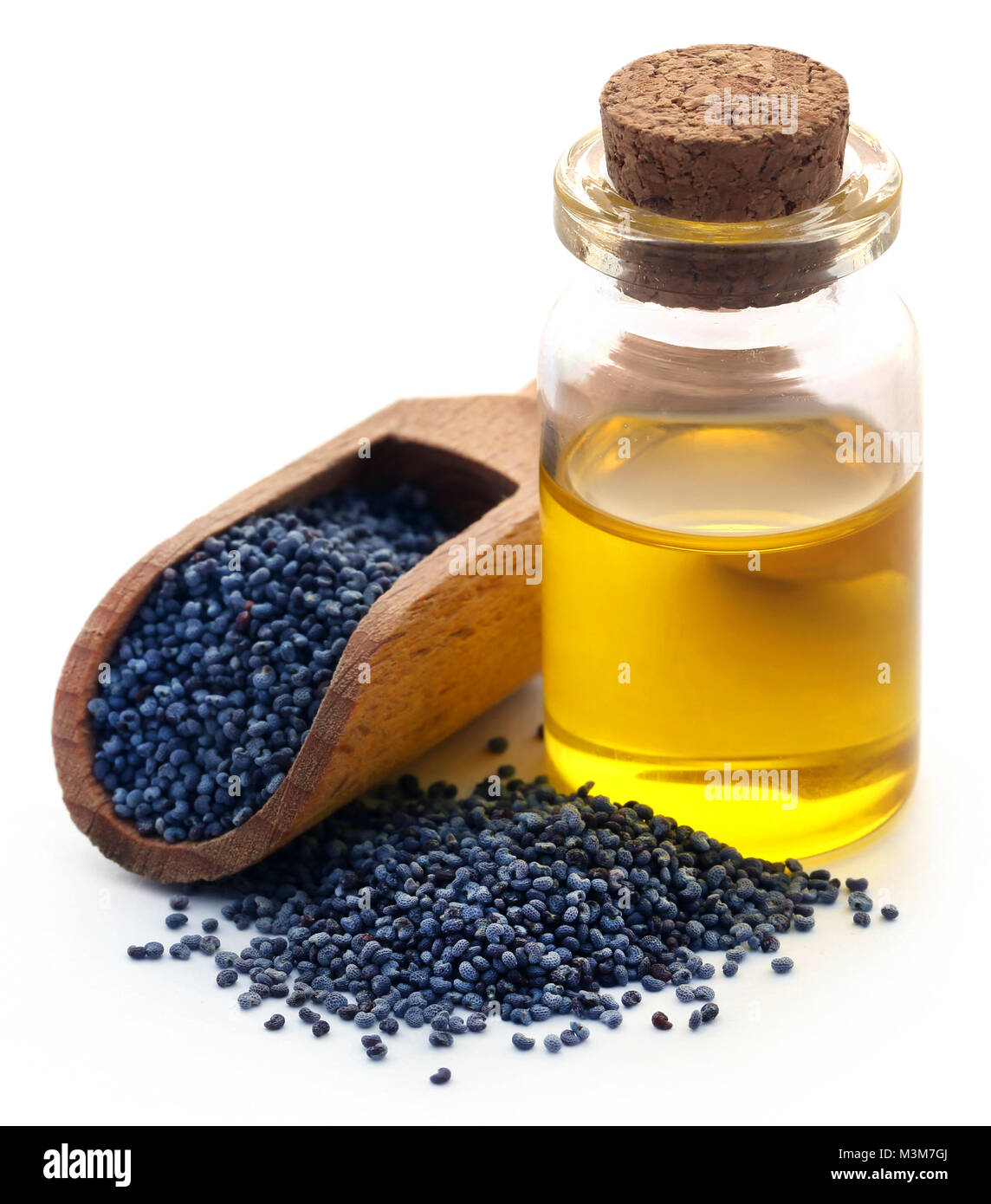 Semi di papavero con olio essenziale in un vaso piccolo Foto Stock