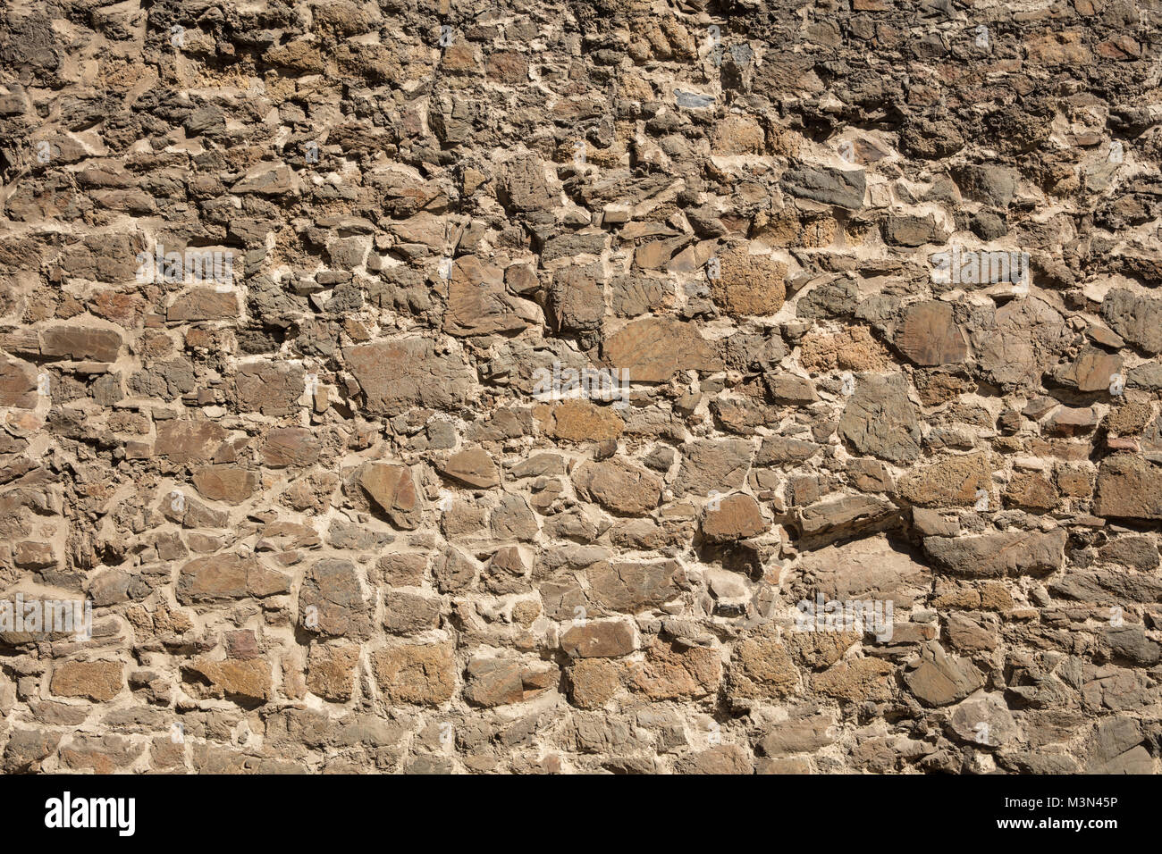 Il vecchio muro di pietra come un formato di texture di sfondo per il riempimento dello Foto Stock