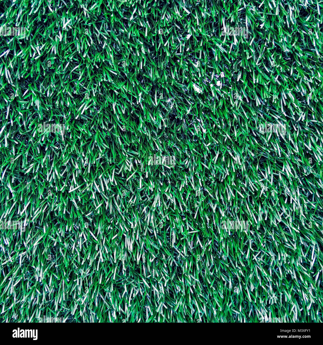 Verde erba naturale texture di sfondo. È artificiale non reale di erba in plastica. Foto Stock