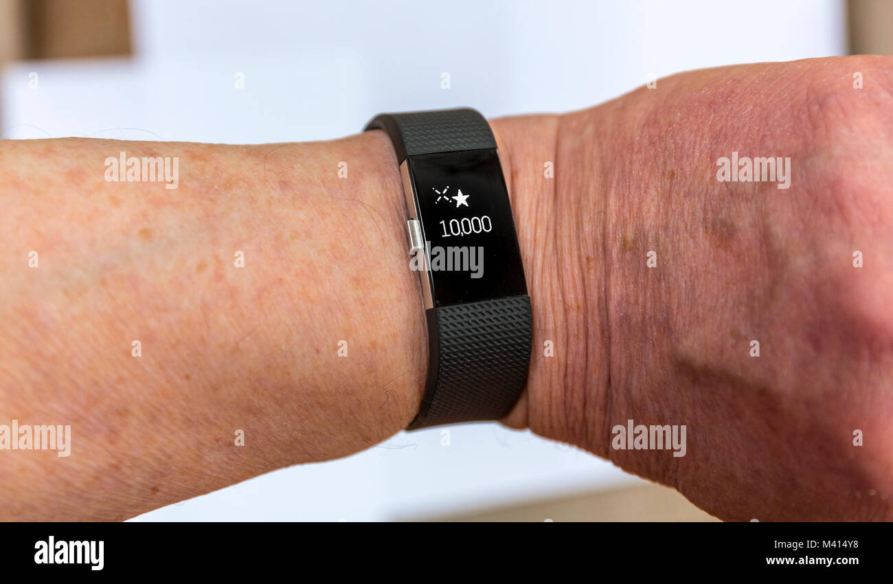 Fitbit tracker di fitness. Stelle per celebrare 10000 passi. Foto Stock