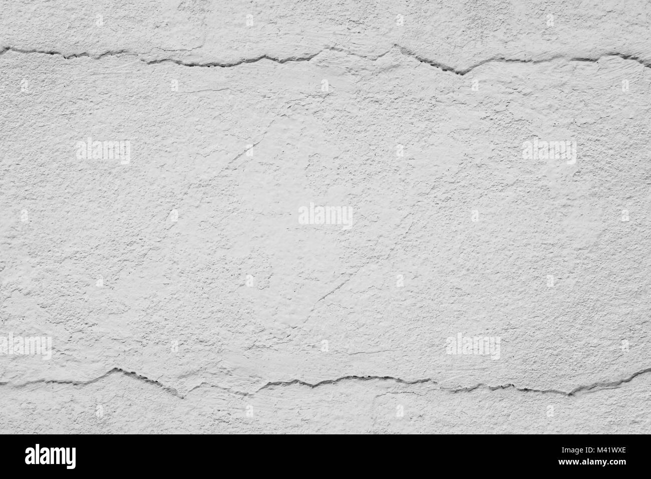 Vecchio di cemento grigio con parete fessurata. Abstract background texture. Foto Stock