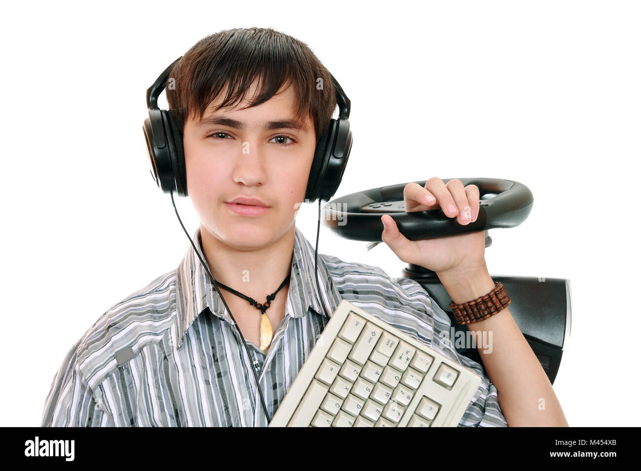 Un adolescente con una guidata da computer e la tastiera Foto Stock