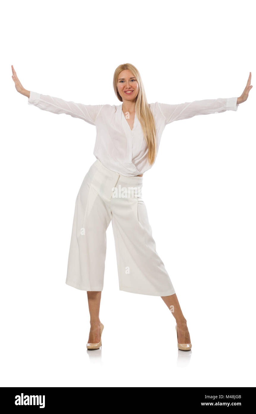 Capelli biondi modello in eleganti pantaloni svasati isolato su bianco Foto Stock