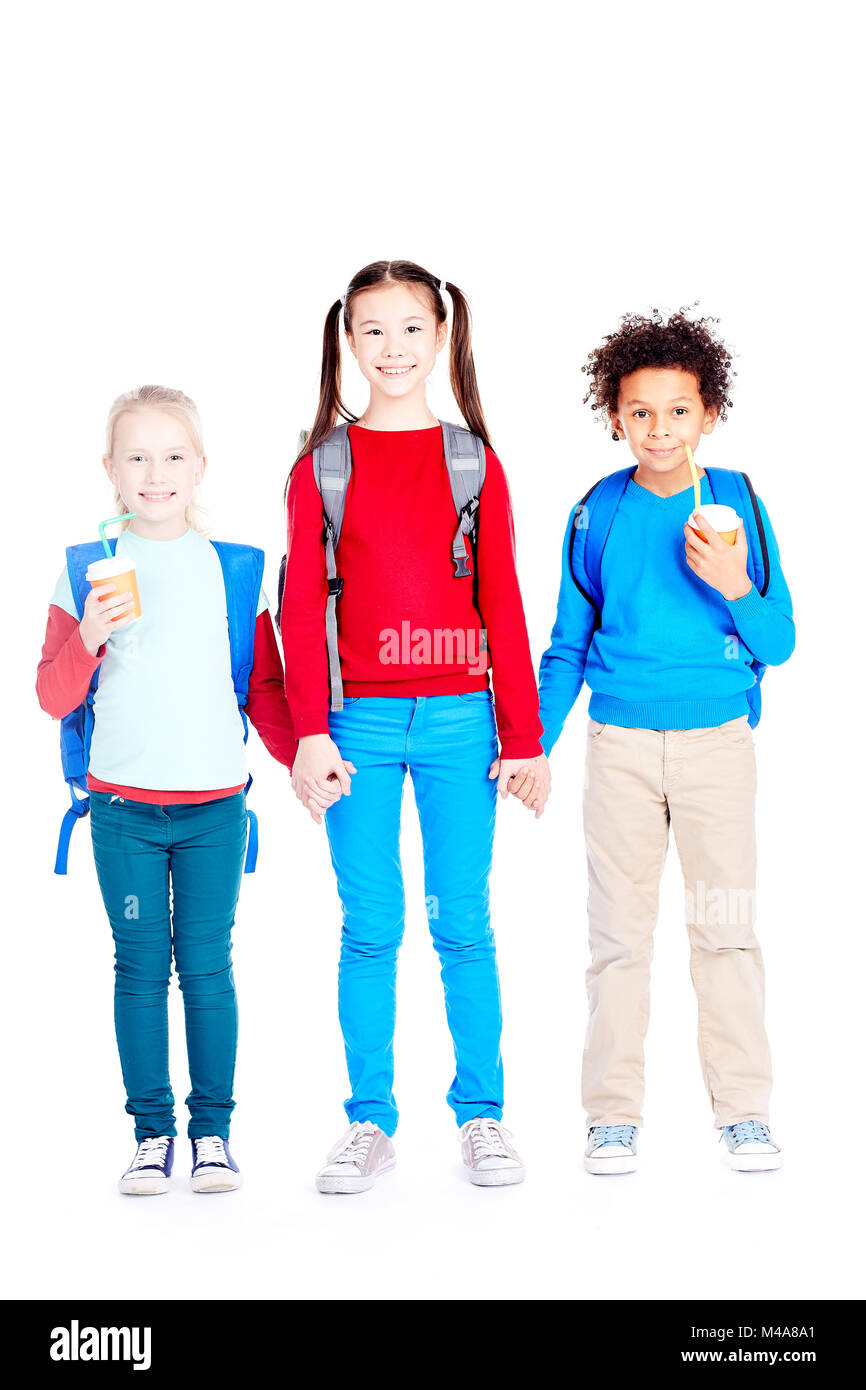 Felice di tre amici di scuola Foto Stock