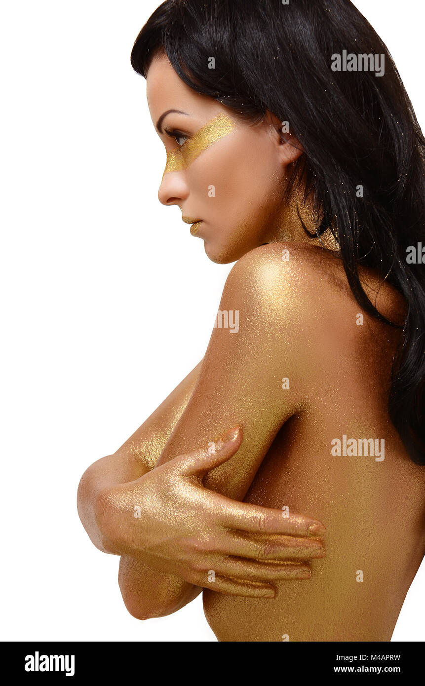 Ragazza con una pelle dorata bodypainting su sfondo bianco Foto Stock