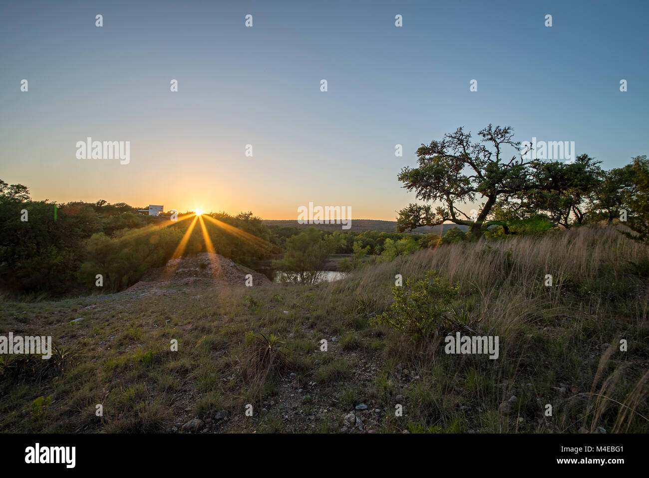 Paesaggi intorno a Willow city loop texas al tramonto Foto Stock