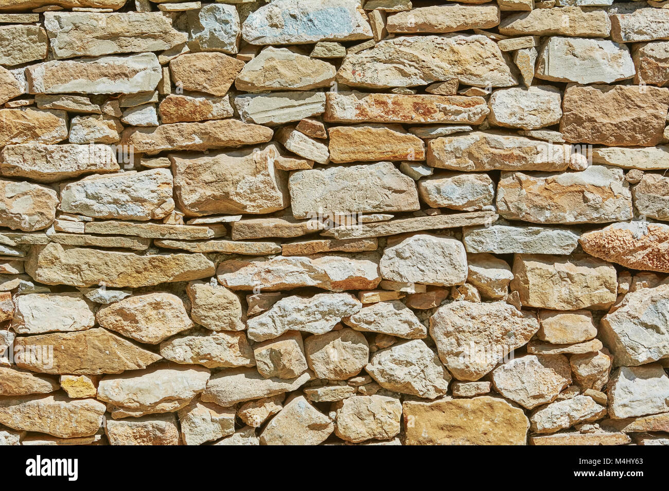 Muro di pietra sullo sfondo Foto Stock