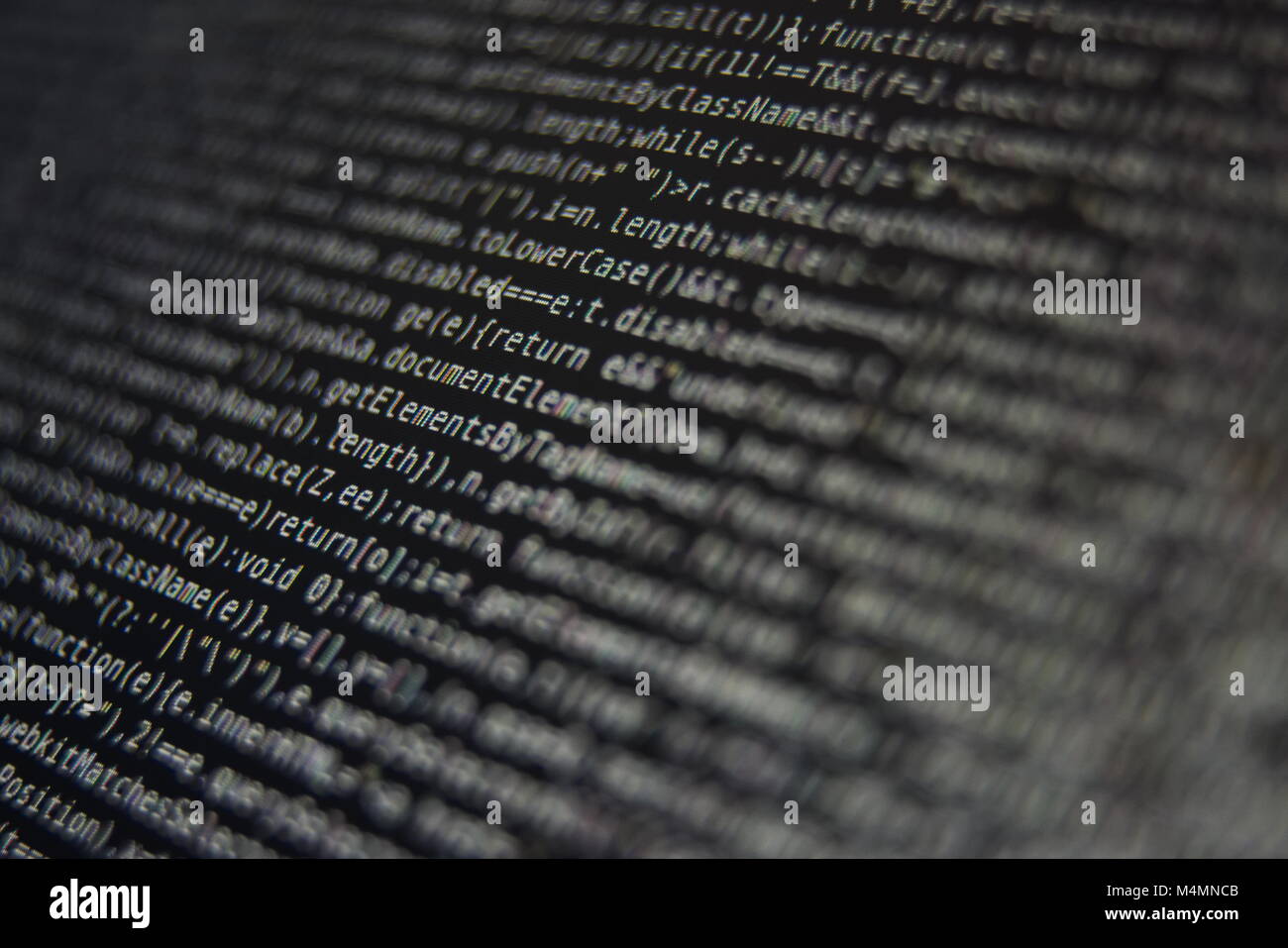 Programma bianco codice sorgente segmento su schermo nero Closeup Foto Stock