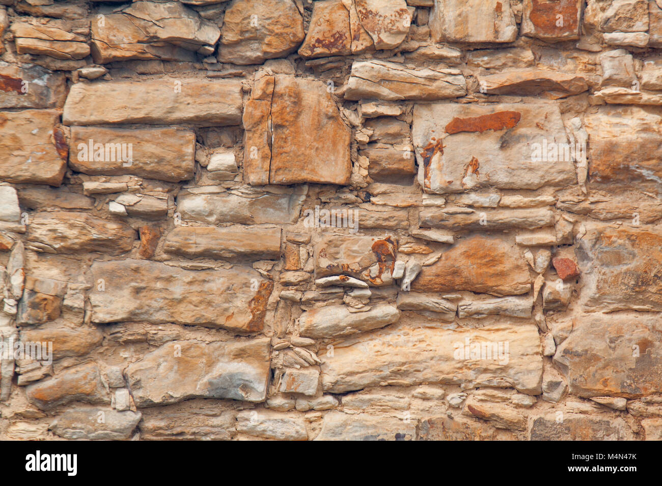 Il dettaglio, primo piano della parete in mattoni di arenaria. La consistenza della pietra arenaria. Può essere utilizzato come sfondo. Foto Stock