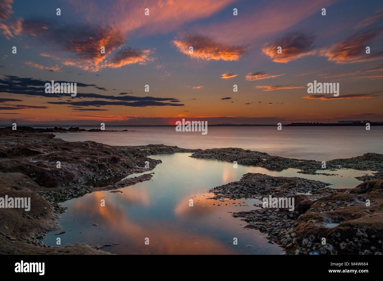 Tramonto a La Perouse con piscina di riflessione, Sydney, Australia Foto Stock