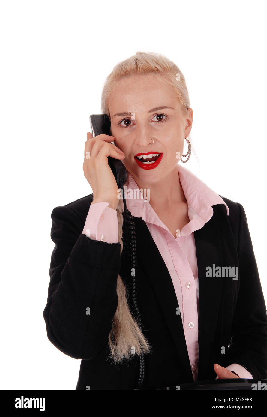 Business donna parlando su un vecchio telefono Foto Stock