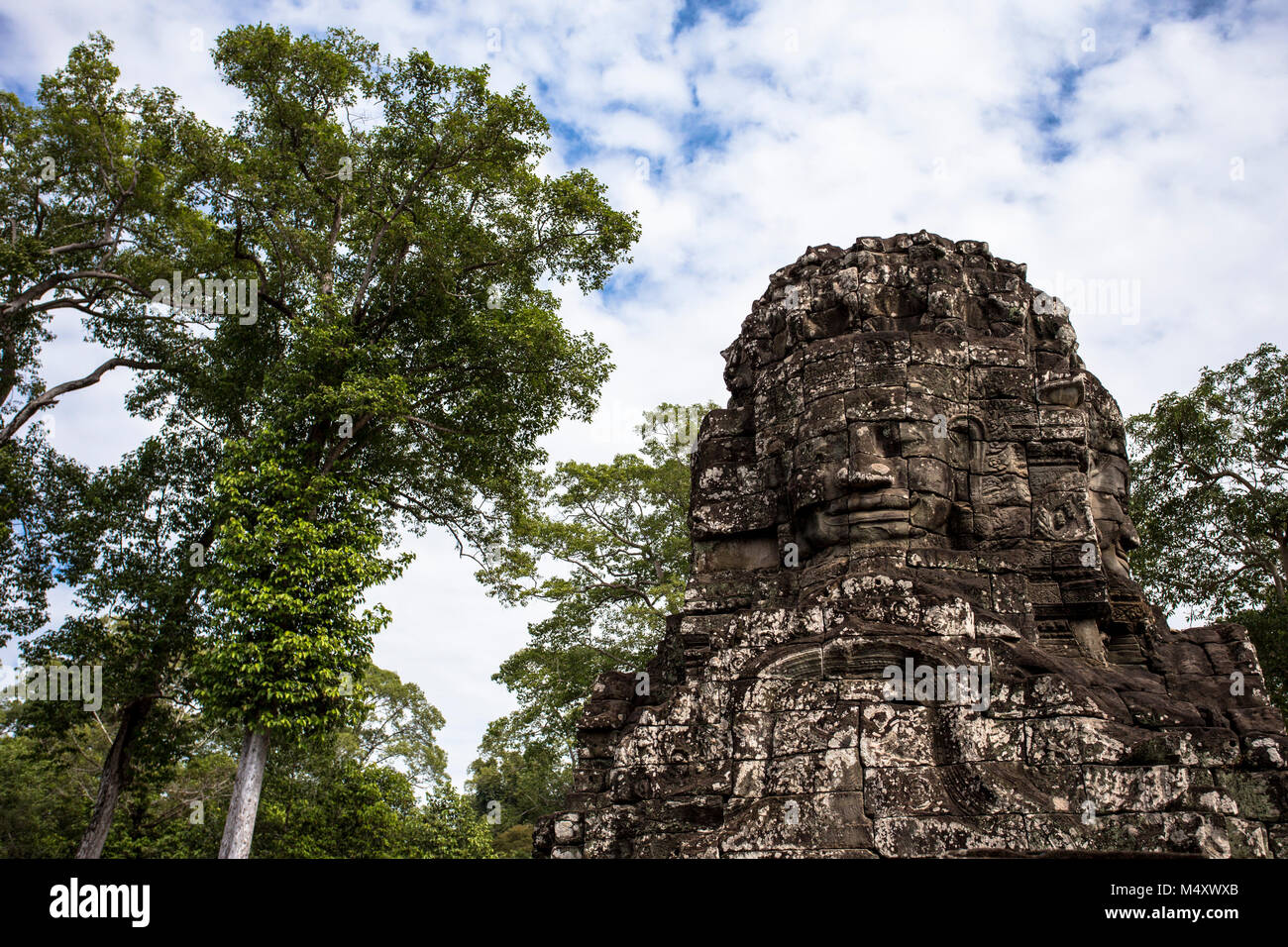 Tempio Bayon Buddha Sorridente faccia Angkor Wat Siem Reap Cambogia Sud Est Asia Travel Foto Stock