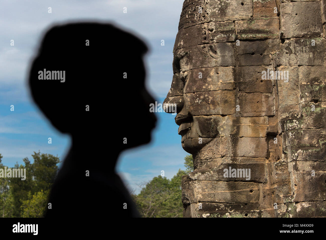 Tempio Bayon Buddha Sorridente faccia Angkor Wat Siem Reap Cambogia Sud Est Asia Travel Foto Stock