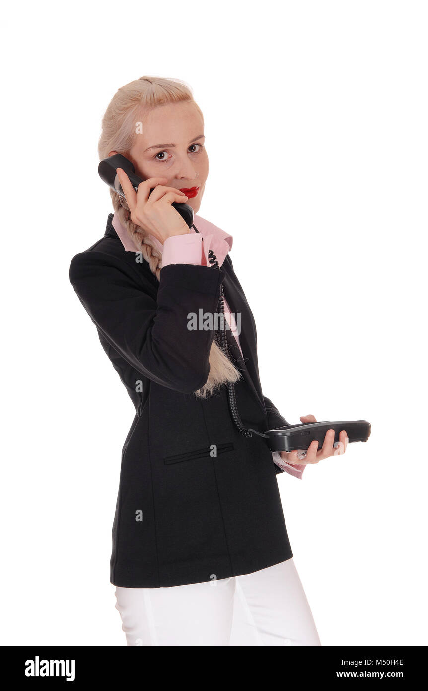 Business donna parlando su un vecchio telefono Foto Stock