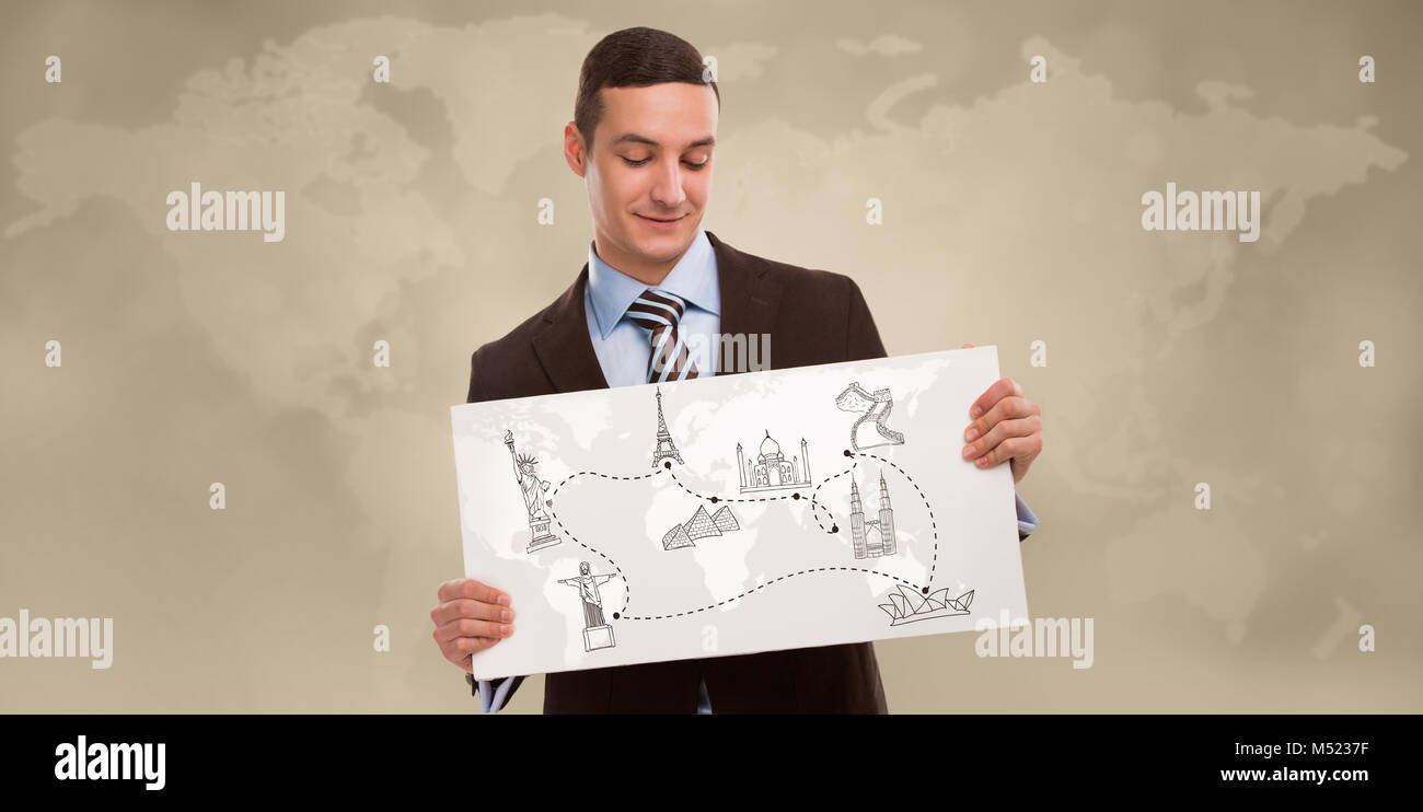 Positivo giovane uomo d affari azienda banner con mappa del mondo e famosi simboli. Business travel concept Foto Stock