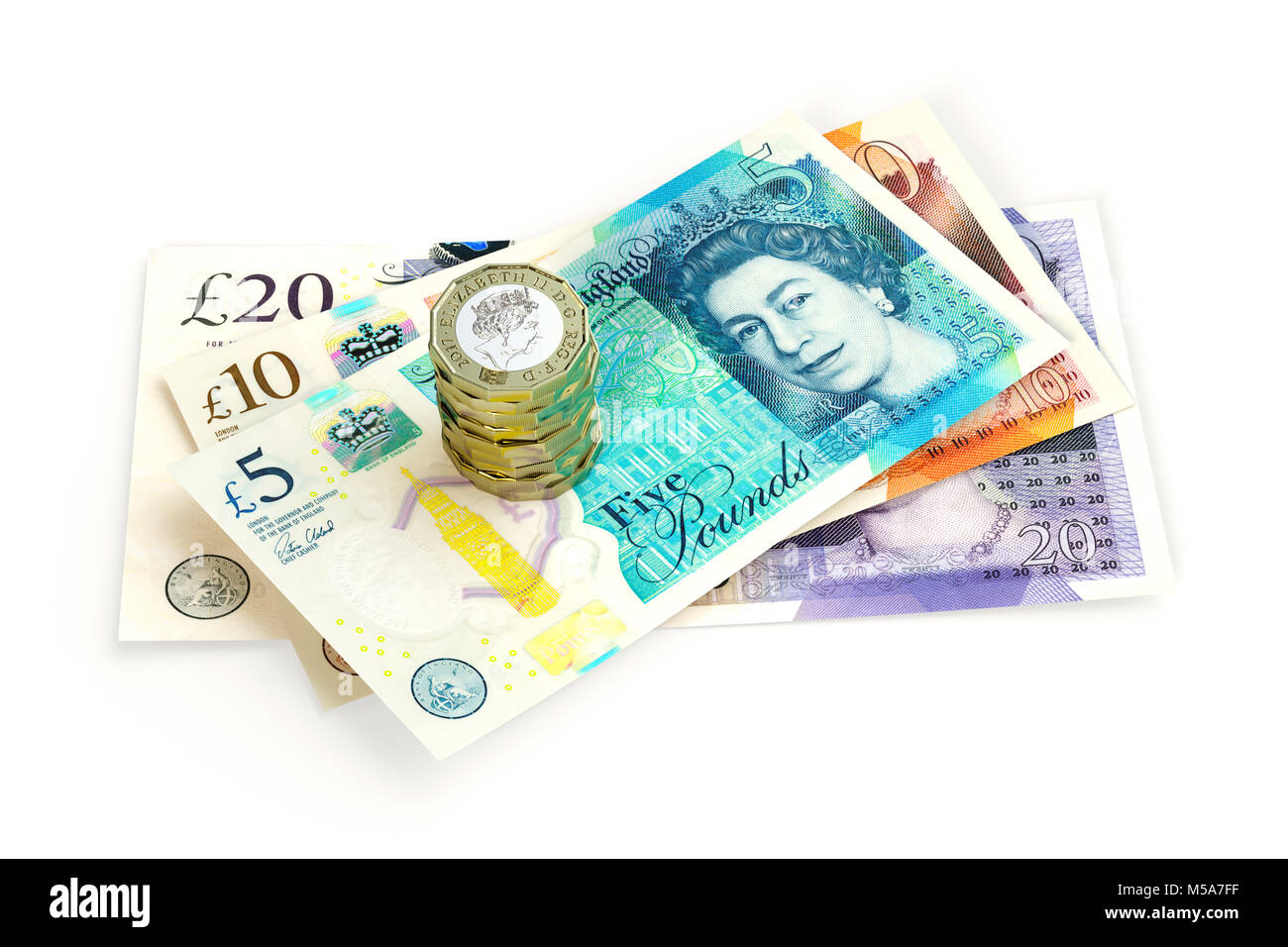 Moneta del Regno Unito - banconote da 2017 £ 20 £ 10 e £ 5 £ primo piano con una pila di monete da £ 1 £ 1 £ Foto Stock