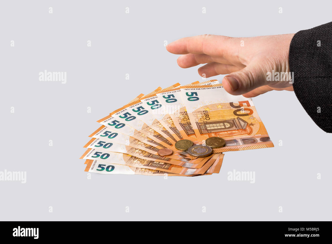 Geld abgreifen und sich bestechen lassen Foto Stock Geld abgreifen und sich bestechen lassen Foto Stock