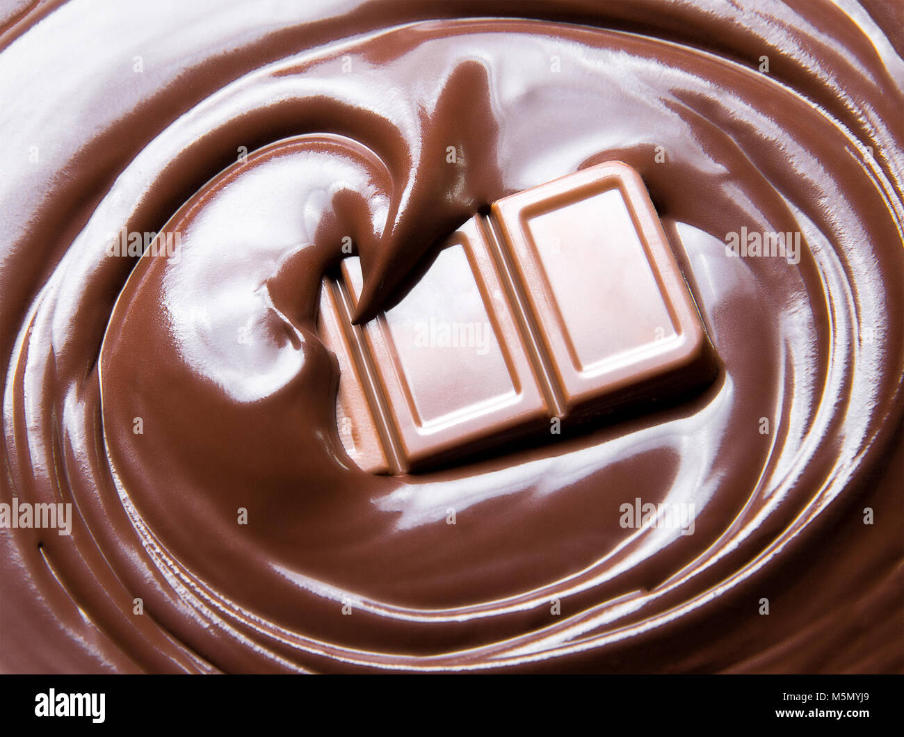 Fondere il cioccolato swirl e barra di cioccolato Foto Stock