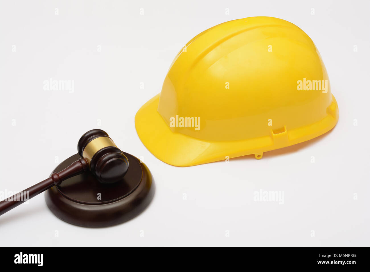 Il diritto del lavoro con la sicurezza e casco martello Foto stock - Alamy