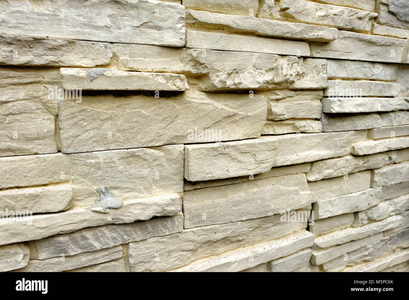 Primo piano di pietra artificiale il rivestimento di parete di roccia per i dettagli Foto Stock