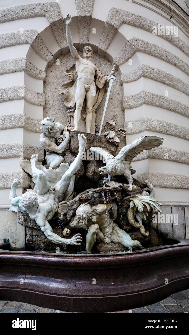 La potenza a terra fontana, il Palazzo di Hofburg, Michaelertrakt, Wien, Vienna, Austria. Foto Stock
