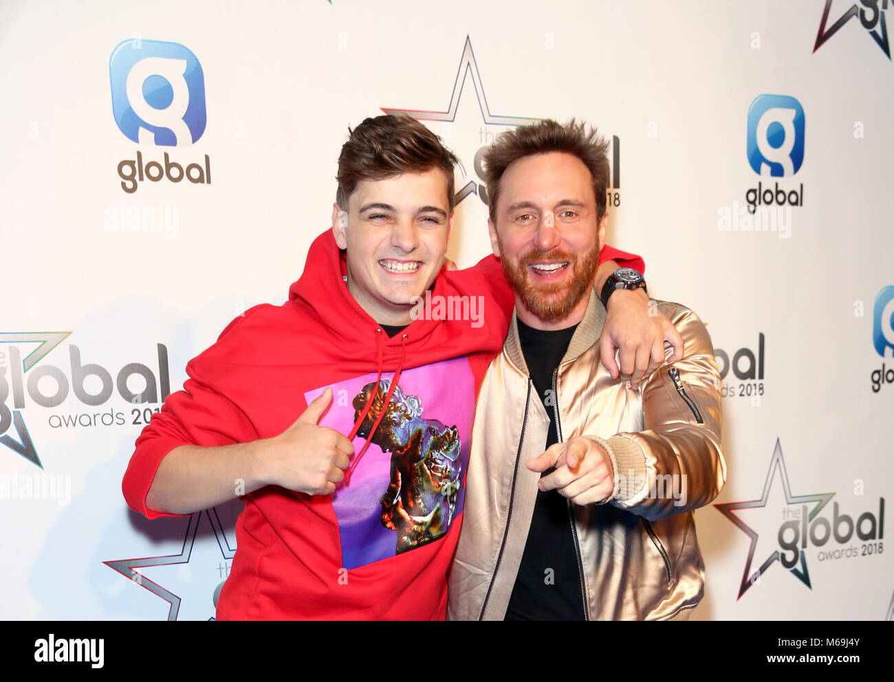 Martin Garrix con il premio per il miglior pop dance e David Guetta in sala stampa al Global Awards, un nuovissimo premi mostra ospitata da Global, Media e Entertainment Group, a Londra, Eventim Apollo Hammersmith. Picture Data: giovedì 1 marzo 2018. Vedere PA storia SHOWBIZ globale. Foto di credito dovrebbe leggere: Isabel Infantes/PA FILO Foto Stock