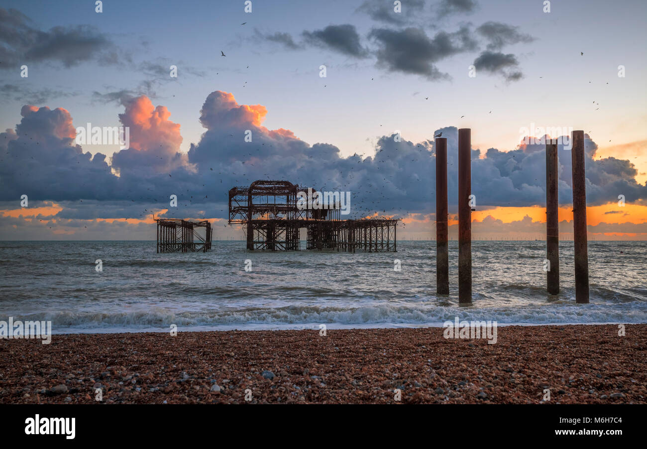 Molo Ovest di Brighton al tramonto Foto Stock