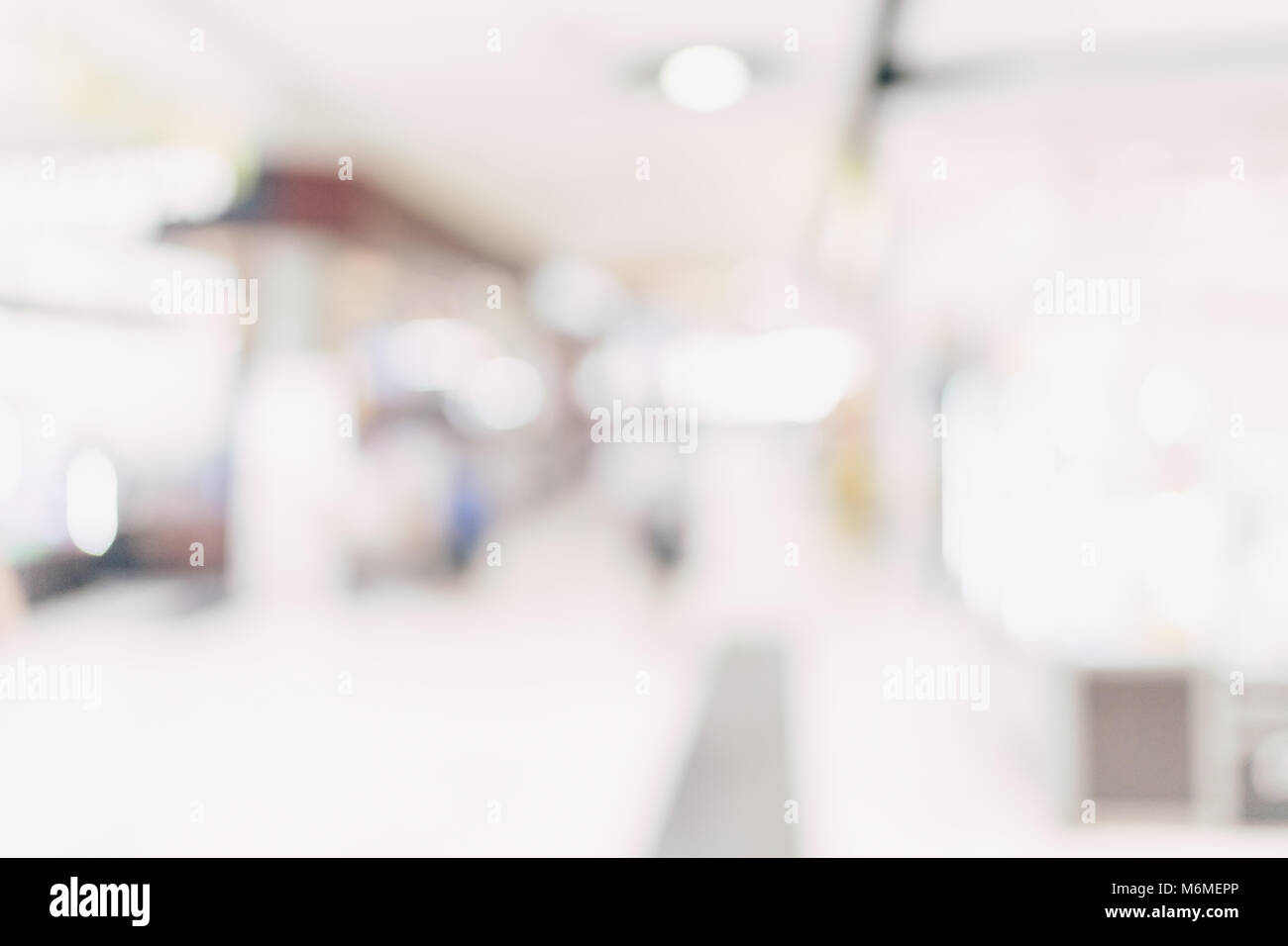 Sfondo sfocato - negozio del centro commerciale per lo shopping di sfocatura con sfondo bokeh di fondo. Foto Stock