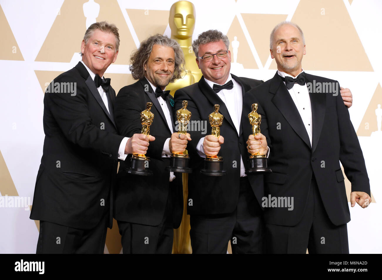 Richard R. Hoover, Paul Lambert, Gerd Nefzer, e John Nelson, vincitori di premi per i migliori effetti visivi", pongono in sala stampa al novantesimo annuale di Academy Awards di Hollywood & Highland Center su Marzo 4, 2018 in Hollywood, la California. Foto Stock