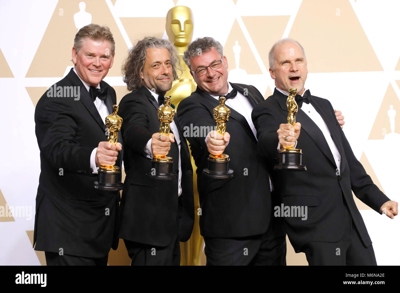 Richard R. Hoover, Paul Lambert, Gerd Nefzer, e John Nelson, vincitori di premi per i migliori effetti visivi", pongono in sala stampa al novantesimo annuale di Academy Awards di Hollywood & Highland Center su Marzo 4, 2018 in Hollywood, la California. Foto Stock