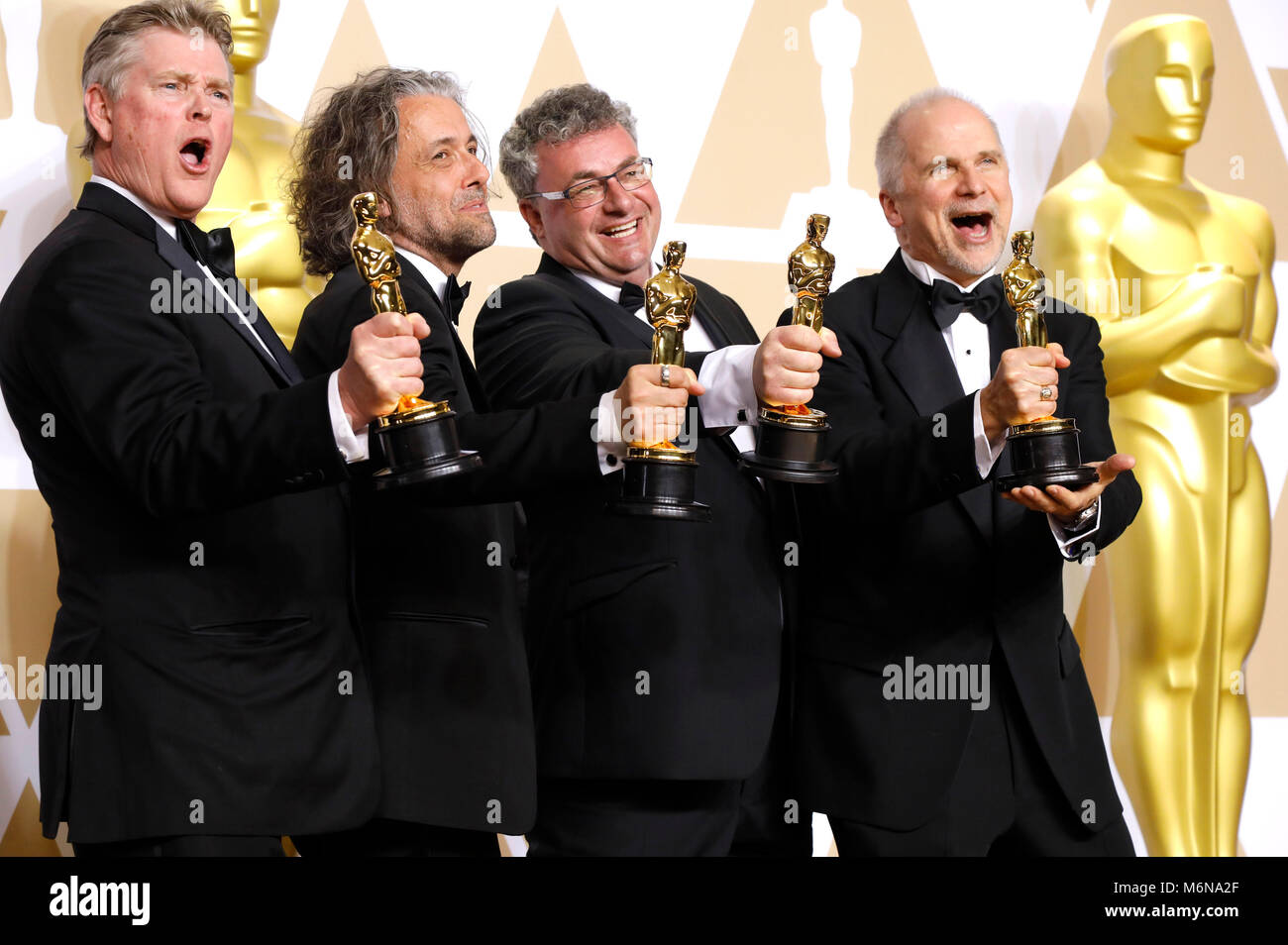 Richard R. Hoover, Paul Lambert, Gerd Nefzer, e John Nelson, vincitori di premi per i migliori effetti visivi", pongono in sala stampa al novantesimo annuale di Academy Awards di Hollywood & Highland Center su Marzo 4, 2018 in Hollywood, la California. Foto Stock