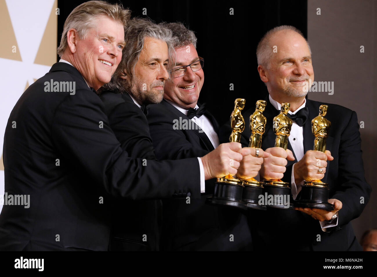 Richard R. Hoover, Paul Lambert, Gerd Nefzer, e John Nelson, vincitori di premi per i migliori effetti visivi", pongono in sala stampa al novantesimo annuale di Academy Awards di Hollywood & Highland Center su Marzo 4, 2018 in Hollywood, la California. Foto Stock