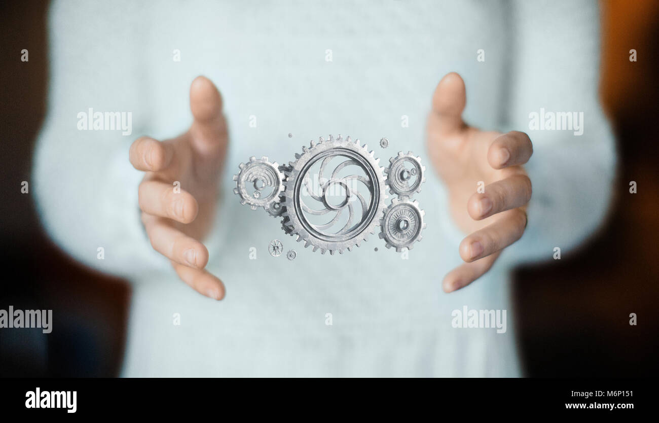 Ingranaggi a portata di mano, il concetto di tecnologia o di idee Foto Stock