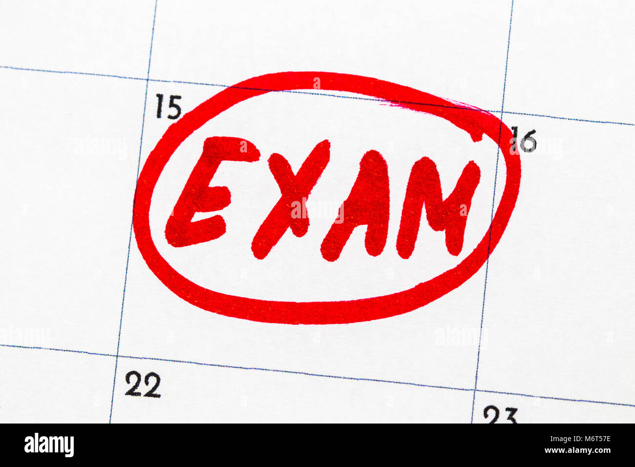 "exam" is the text written on the calendar in red marker. Foto Stock