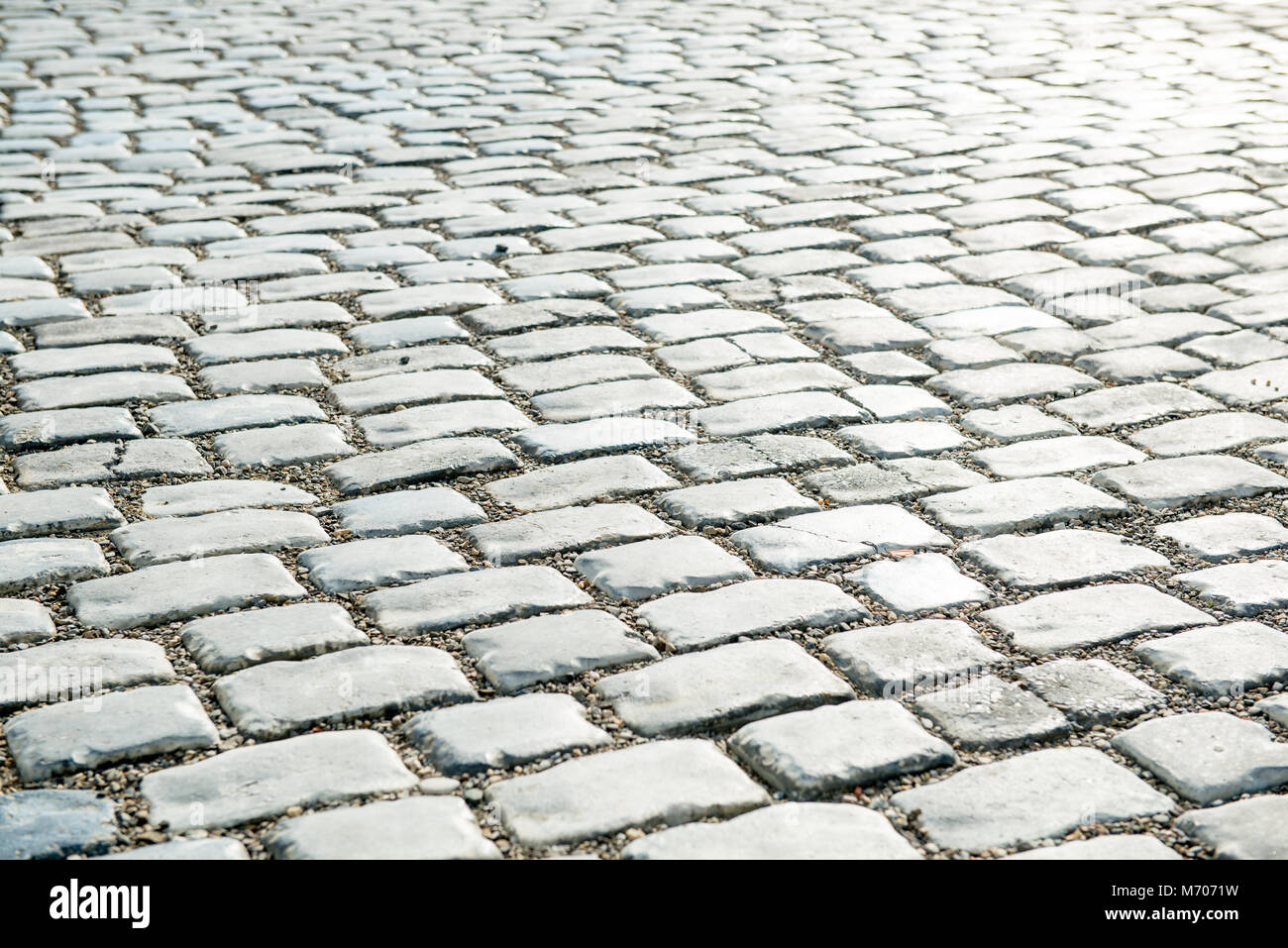 Strada pavimentata con ciottoli per il tuo sfondo Foto Stock