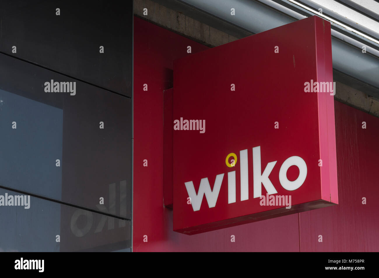 Il logo del leggendario high street famiglia essentials store Wilko, o Wilkos. A. St Austell, mid-Cornwall. Foto Stock