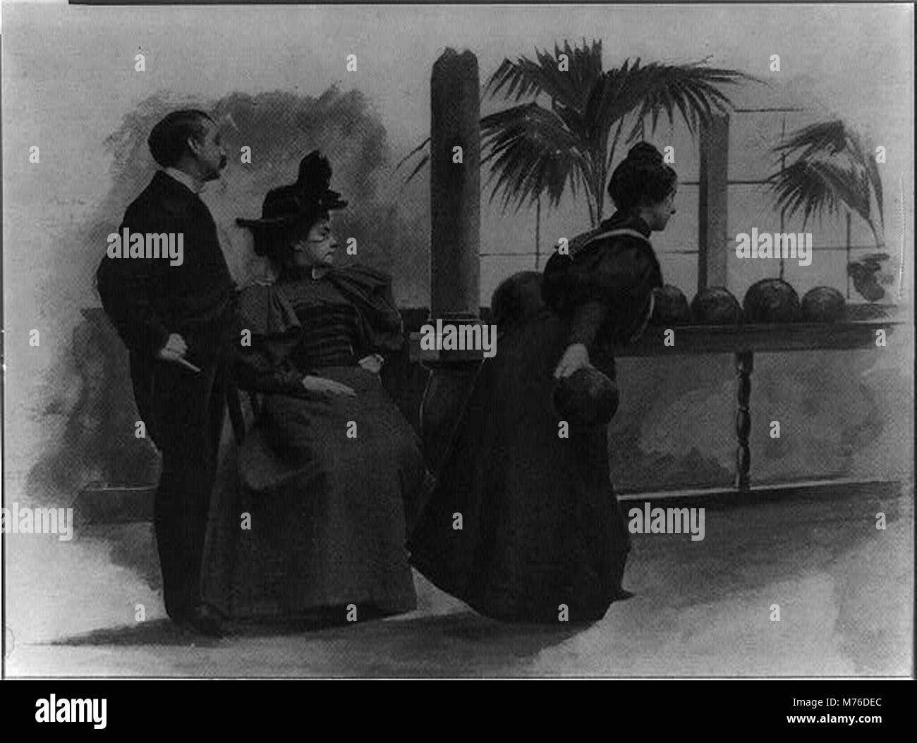 Una vivace scena di Atlantic City durante la marea di Pasqua, che mostra una donna che gioca a bowling mentre un uomo e un'altra donna guardano, catturando un momento di svago e svago. Foto Stock