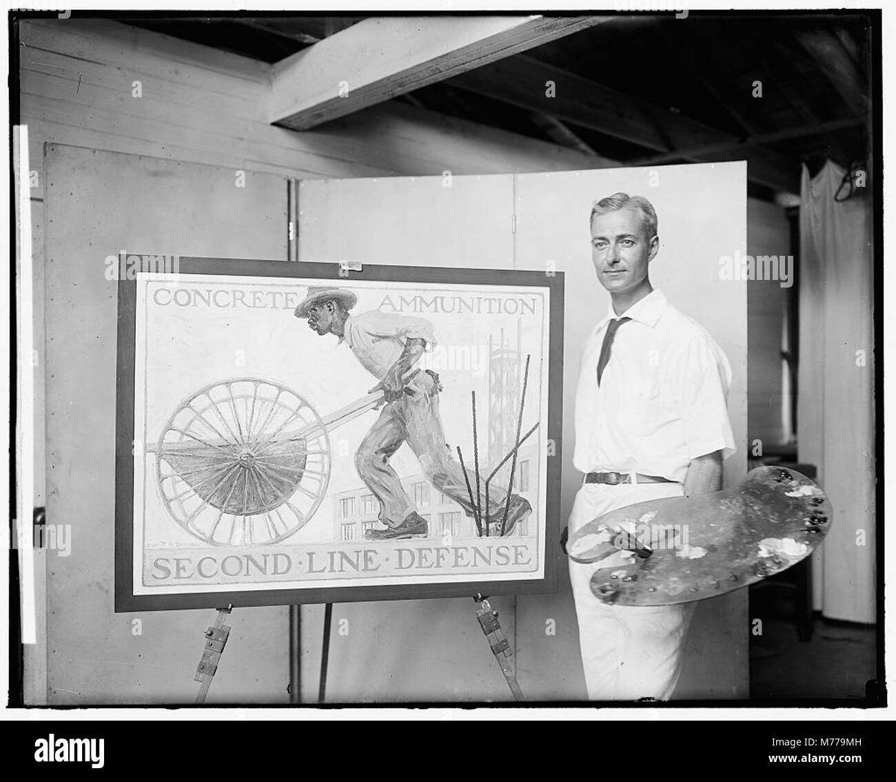 Un artista associato al Dipartimento del lavoro degli Stati Uniti è mostrato lavorare su un poster di reclutamento della prima guerra mondiale. Questa immagine riflette il ruolo dell'arte nella propaganda in tempo di guerra. Foto Stock