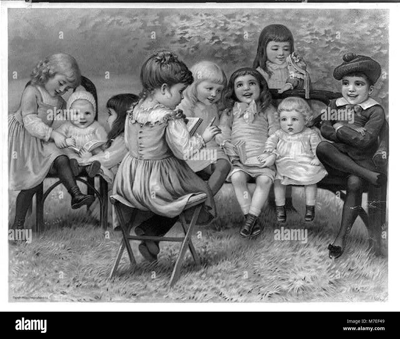 Una scena di una persona che interpreta il ruolo di un insegnante, raffigurata in questa fotografia. L'immagine riflette l'influenza degli educatori nel plasmare le giovani menti, spesso servendo come modelli di ruolo e mentori in classe. Foto Stock Una scena di una persona che interpreta il ruolo di un insegnante, raffigurata in questa fotografia. L'immagine riflette l'influenza degli educatori nel plasmare le giovani menti, spesso servendo come modelli di ruolo e mentori in classe. Foto Stock