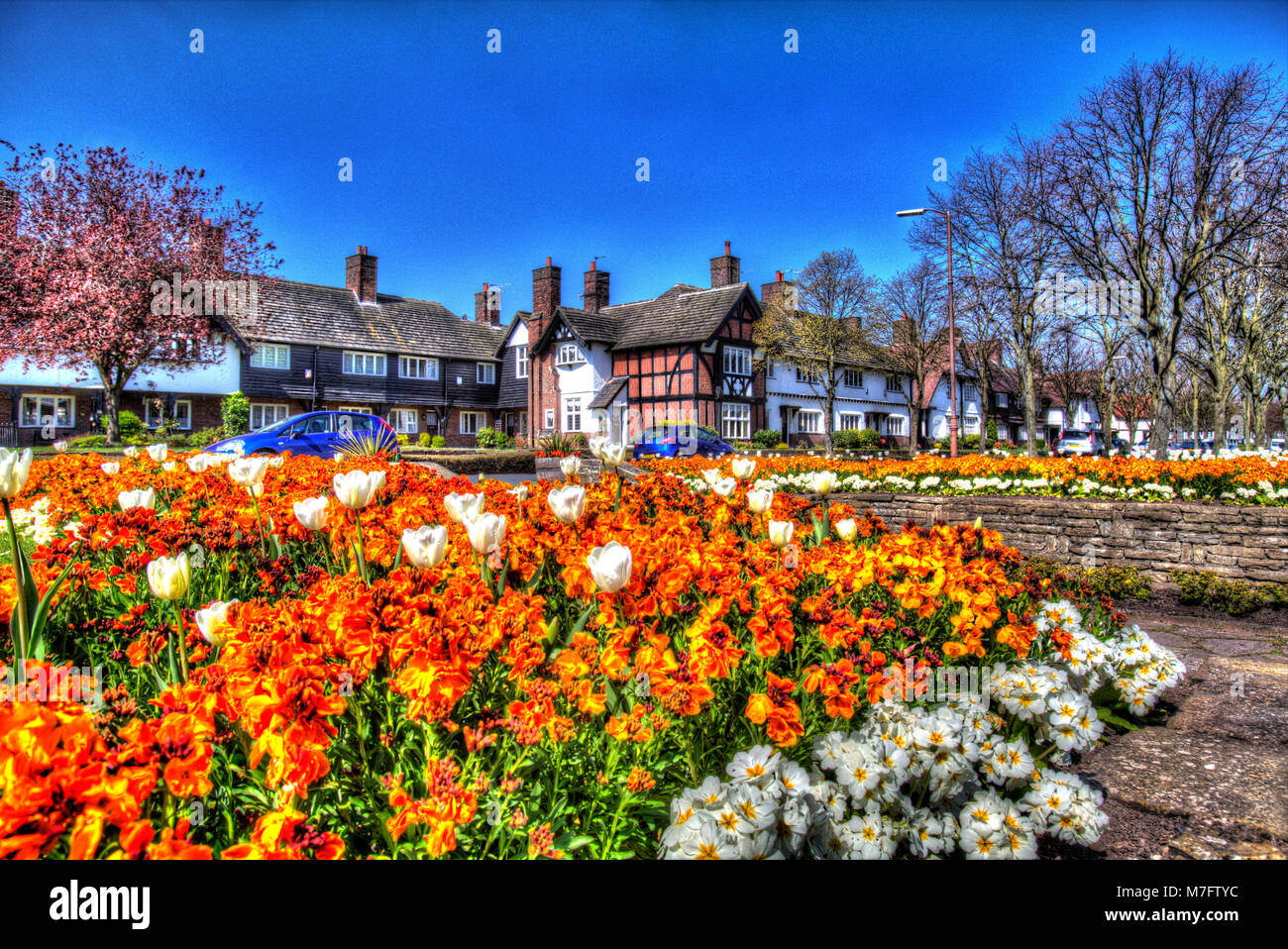 Villaggio di Port Sunlight, Inghilterra. Molla artistico vista di Port Sunlight Diamante del giardino. Foto Stock