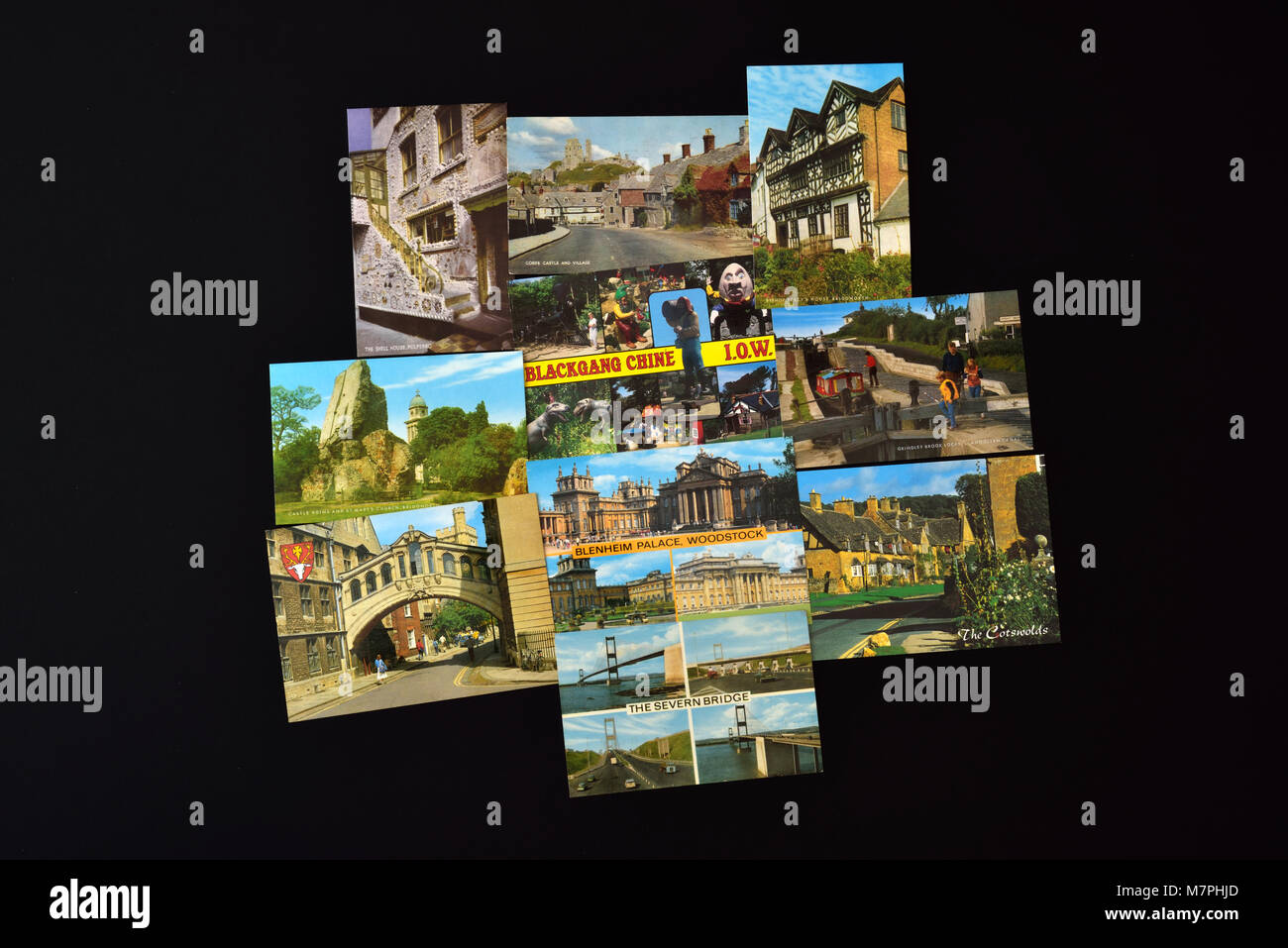 Dieci J assortiti Salmon Ltd cartoline raffiguranti inglese e gallese, viste mostrato su uno sfondo nero. Foto Stock